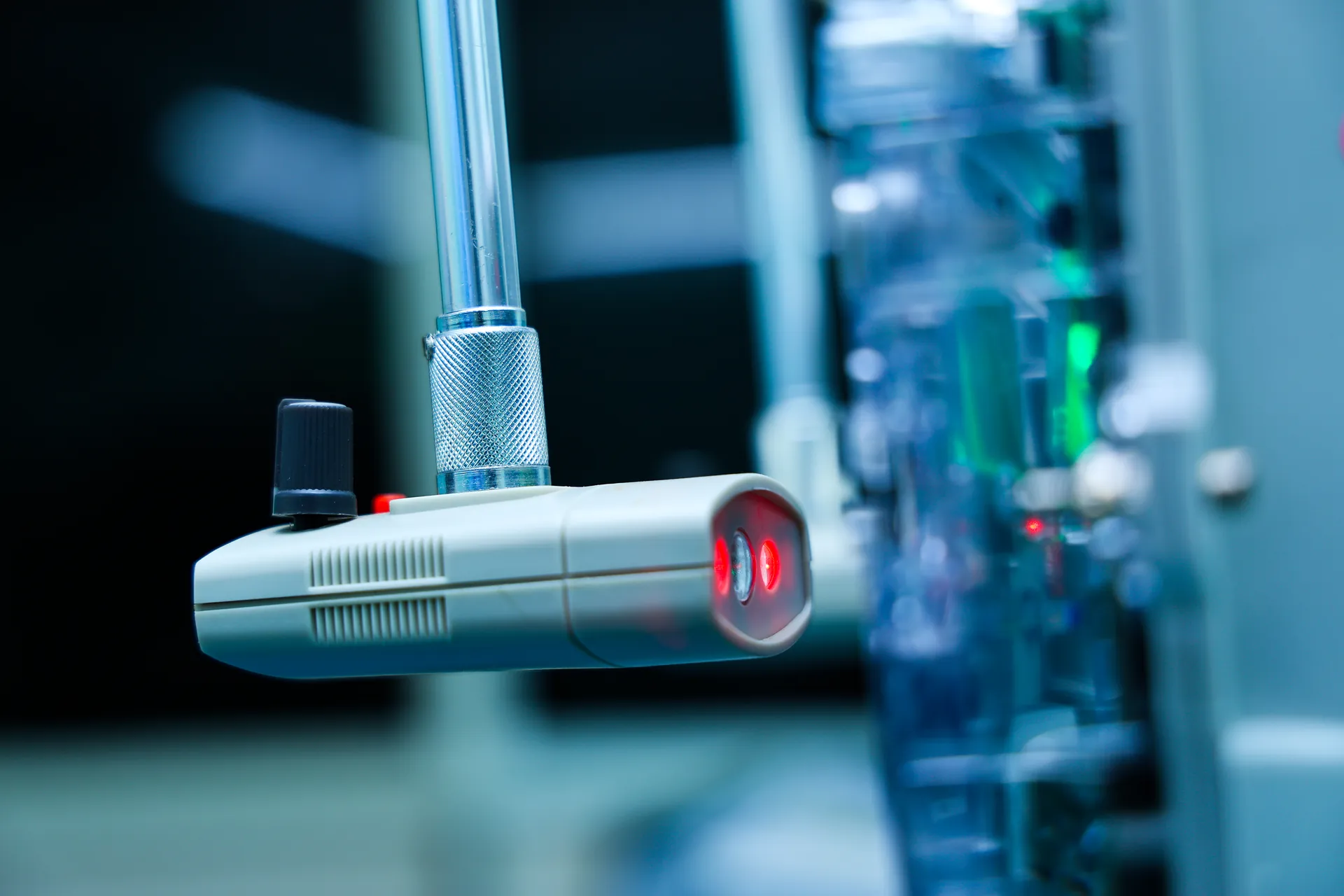 Close-up of optical pickup aligned to meter calibration LED